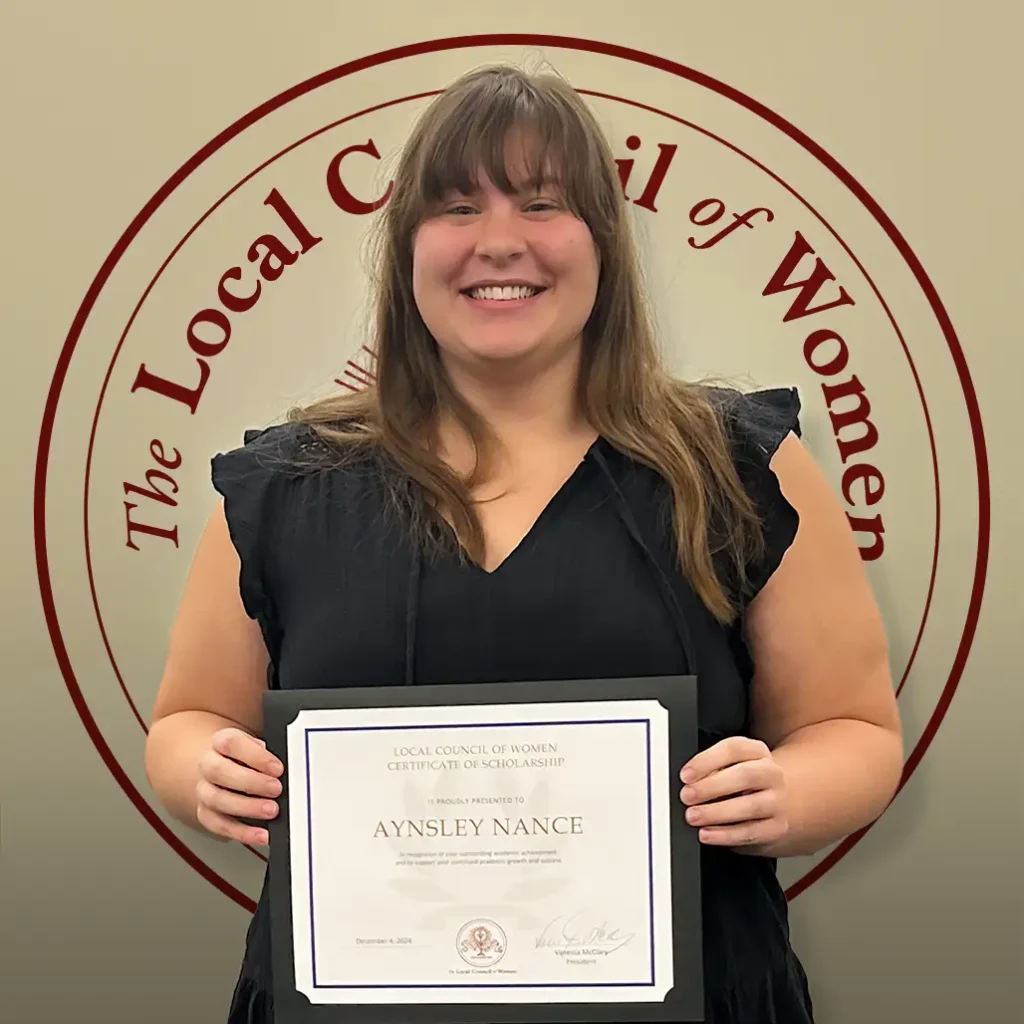 Aynsley Nance holding her $1,000 scholarship certificate at the 2024 LCW Annual Meeting.