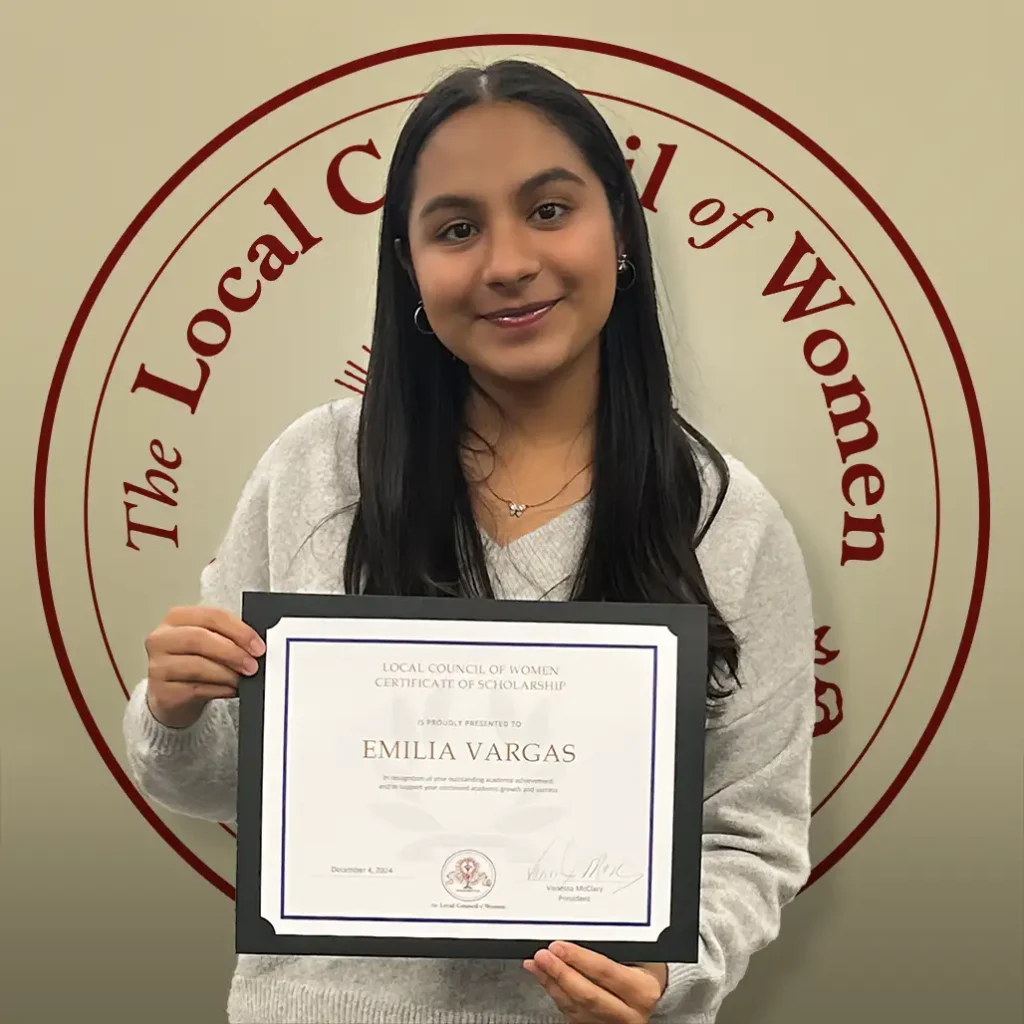 Emilia Vargas holding her $1,000 scholarship certificate at the 2024 LCW Annual Meeting.