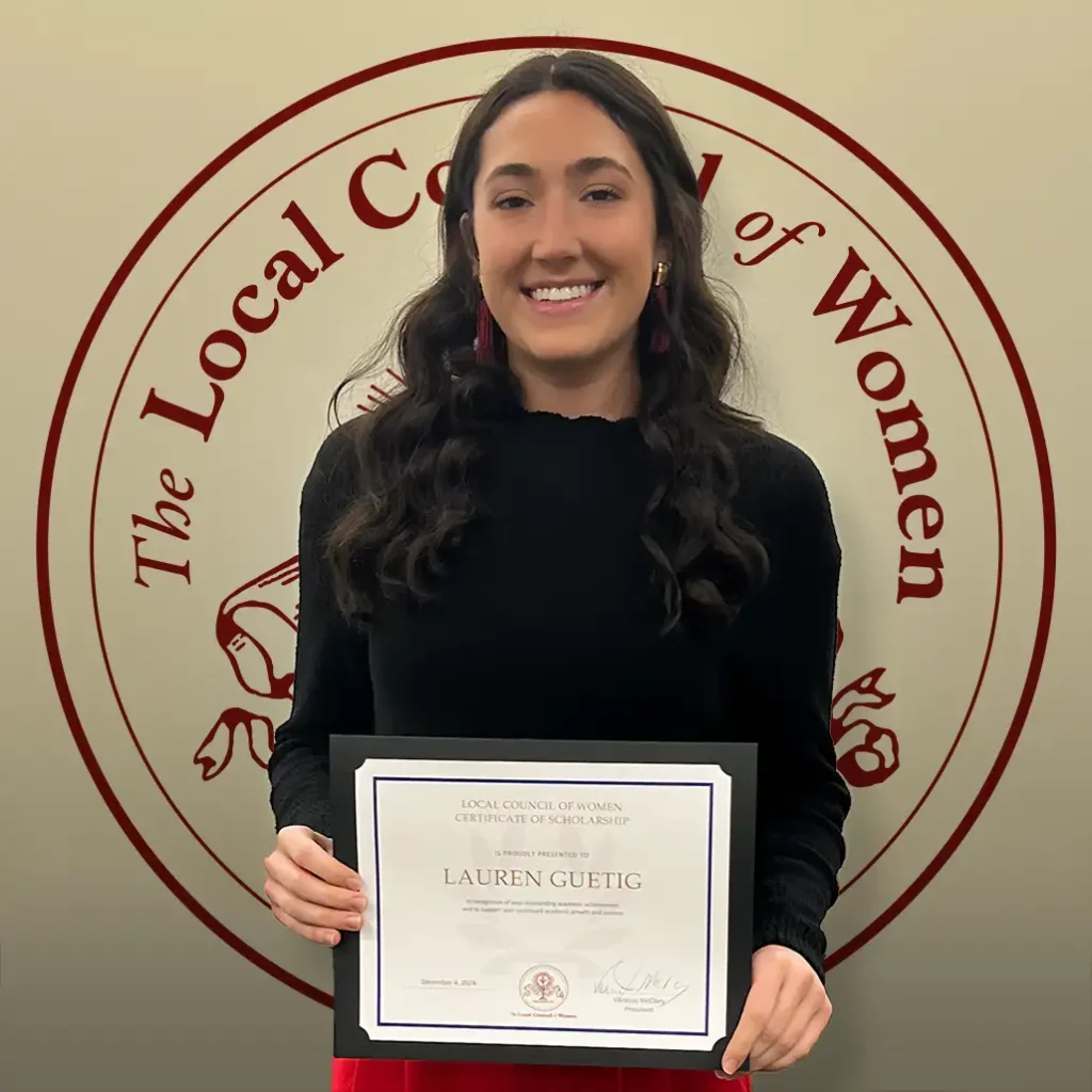 Lauren Guetig holding her $1,000 scholarship certificate at the 2024 LCW Annual Meeting.